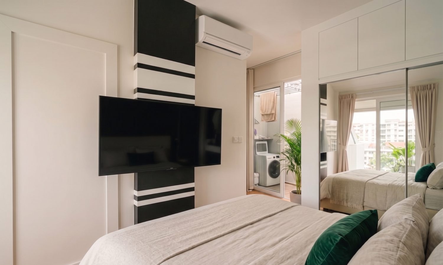 The master bedroom: linen bed, soft daylight, mirrored wardrobe and a wall-mounted television